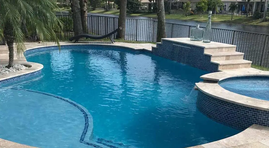 Pool with a Hawaiian glass-bead finish, free-form pool with raised spa
