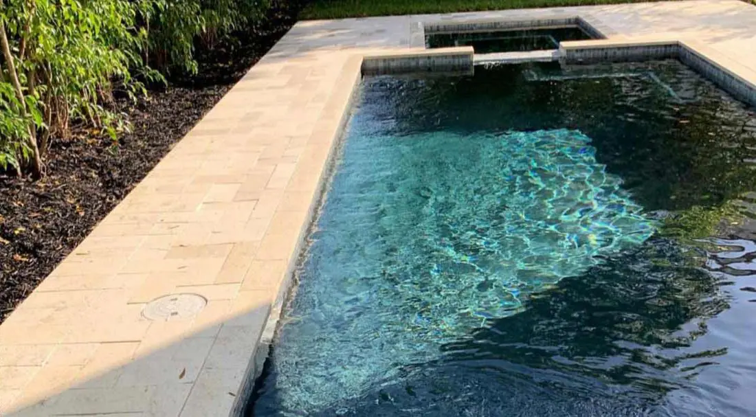 Pool with a Lagoon glass-bead finish, rectangular pool with a dark, reflective finish