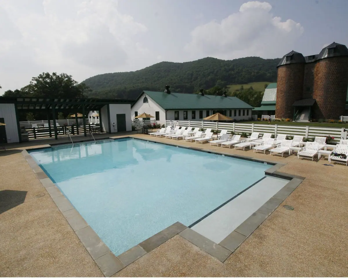 Community pool with Classic white finish and lounge deck