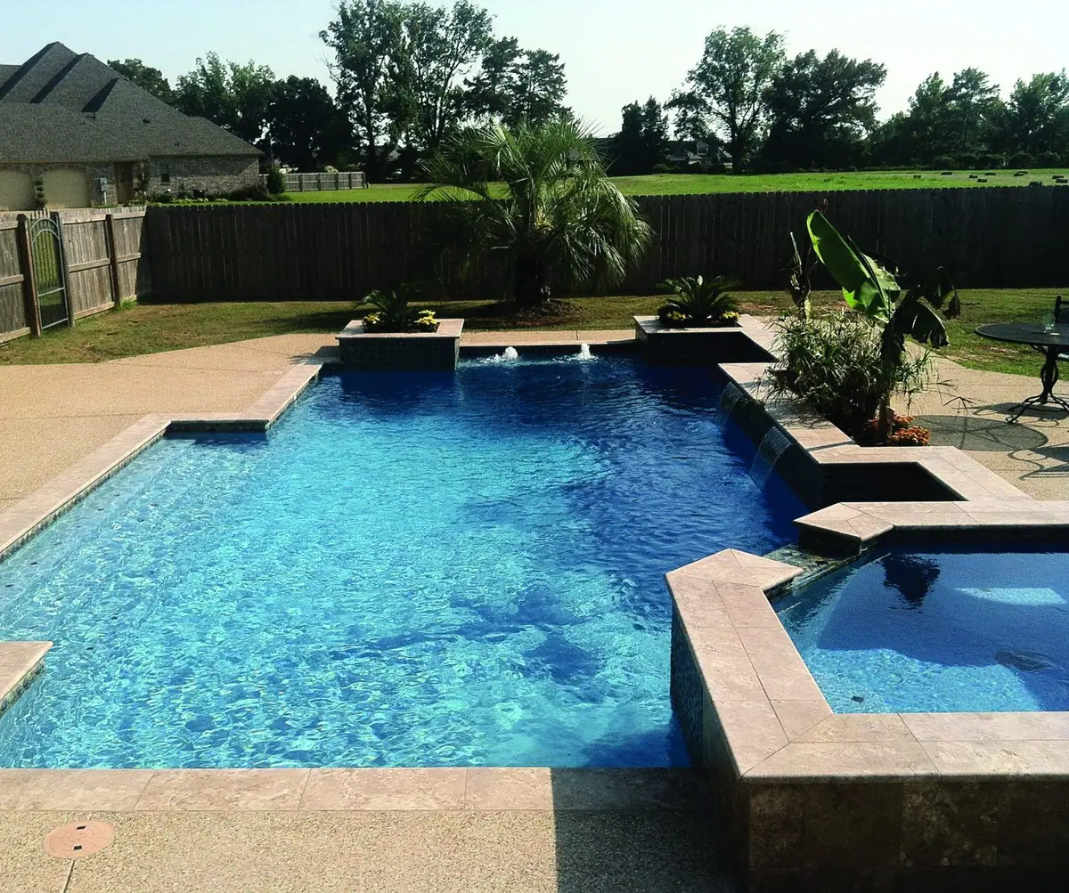 Geometric pool with Tahoe Blue quartz finish and raised spa